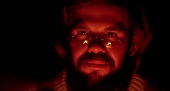 Movie still from “Never Cry Wolf” (1983), directed by Carroll Ballard – A person wearing glasses and a beard; Close Up shot, Low angle
