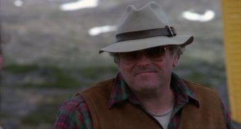 Movie still from “Never Cry Wolf” (1983), directed by Carroll Ballard – A person wearing a hat and sunglasses; Close Up shot, Low angle