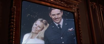 Movie still from “Never Say Never Again” (1983), directed by Irvin Kershner – A picture of a man and a woman in uniform; Close Up shot, Low angle
