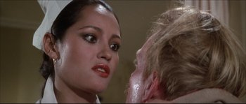 Movie still from “Never Say Never Again” (1983), directed by Irvin Kershner – A woman is looking at a man's face; Close Up shot, Over the shoulder angle