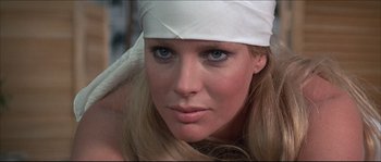 Movie still from “Never Say Never Again” (1983), directed by Irvin Kershner – A person wearing a white hat; Close Up shot, Low angle