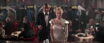 Movie still from “Never Say Never Again” (1983), directed by Irvin Kershner – A man and a woman standing in front of a mirror; Medium shot, Over the shoulder angle