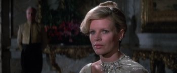 Movie still from “Never Say Never Again” (1983), directed by Irvin Kershner – A person wearing a dress; Close Up shot, Low angle