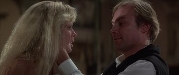 Movie still from “Never Say Never Again” (1983), directed by Irvin Kershner – A man and a woman looking at one another; Close Up shot, Over the shoulder angle