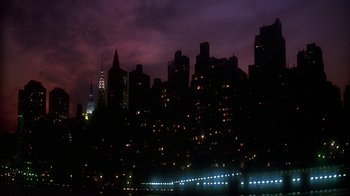 Movie still from “New Jack City” (1991), directed by Mario Van Peebles – A view of a city skyline at night with lights on; Extreme Wide shot, High angle