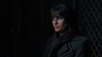 Movie still from “New Year's Eve” (2011), directed by Garry Marshall – A woman in a black coat and a scarf; Close Up shot, High angle