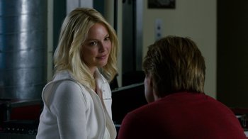 Movie still from “New Year's Eve” (2011), directed by Garry Marshall – A woman standing next to another woman in a room; Close Up shot, Over the shoulder angle