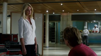 Movie still from “New Year's Eve” (2011), directed by Garry Marshall – A woman standing next to a man in a room; Medium shot, Over the shoulder angle