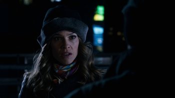 Movie still from “New Year's Eve” (2011), directed by Garry Marshall – A woman wearing a hat and a scarf looking at a man; Close Up shot, Over the shoulder angle