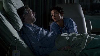 Movie still from “New Year's Eve” (2011), directed by Garry Marshall – A man and a woman sitting in a bed; Medium shot, High angle