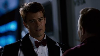 Movie still from “New Year's Eve” (2011), directed by Garry Marshall – A man wearing a bow tie and a tuxedo; Close Up shot, Over the shoulder angle