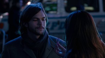 Movie still from “New Year's Eve” (2011), directed by Garry Marshall – A man and a woman are looking at each other; Close Up shot, Over the shoulder angle