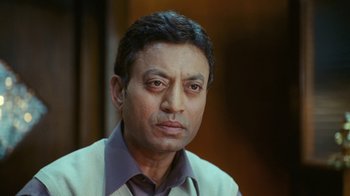 Movie still from “New York, I Love You” (2008), directed by Wen Jiang – A person wearing a shirt and tie; Close Up shot, Low angle