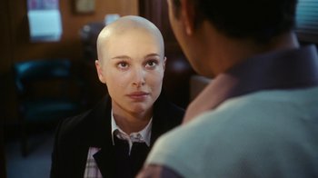 Movie still from “New York, I Love You” (2008), directed by Wen Jiang – A woman with a shaved head looking into a mirror; Close Up shot, Over the shoulder angle