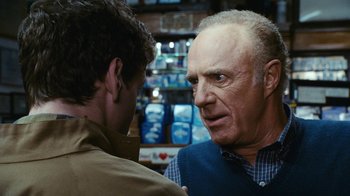 Movie still from “New York, I Love You” (2008), directed by Wen Jiang – A man talking to another man in front of a store; Close Up shot, Over the shoulder angle