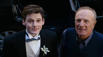 Movie still from “New York, I Love You” (2008), directed by Wen Jiang – A young man and an older man posing for a picture; Close Up shot, Over the shoulder angle