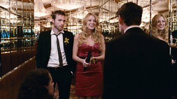 Movie still from “New York, I Love You” (2008), directed by Wen Jiang – A man and a woman standing next to each other in front of another man; Medium shot, Over the shoulder angle