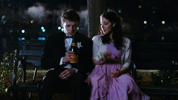 Movie still from “New York, I Love You” (2008), directed by Wen Jiang – A man and a woman sitting next to each other on a park bench; Medium shot, Over the shoulder angle