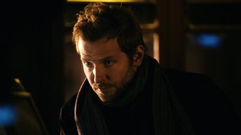 Movie still from “New York, I Love You” (2008), directed by Wen Jiang – A person wearing a scarf; Close Up shot, Over the shoulder angle