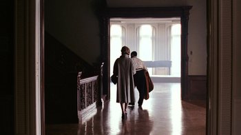 Movie still from “New York, I Love You” (2008), directed by Wen Jiang – Two people are walking down a hall way; Wide shot, Low angle