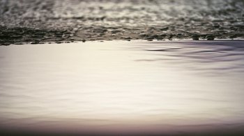 Movie still from “New York, I Love You” (2008), directed by Wen Jiang – A very close up view of a body of water; Extreme Close Up shot, Low angle