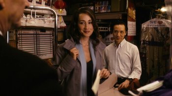 Movie still from “New York, I Love You” (2008), directed by Wen Jiang – A woman standing next to a man in a restaurant; Medium shot, Over the shoulder angle