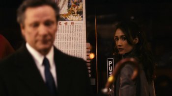 Movie still from “New York, I Love You” (2008), directed by Wen Jiang – A man and a woman standing next to each other in front of an elevator; Close Up shot, Over the shoulder angle