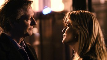 Movie still from “New York, I Love You” (2008), directed by Wen Jiang – A man and a woman face to face in front of lights; Close Up shot, Over the shoulder angle