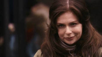 Movie still from “New York, I Love You” (2008), directed by Wen Jiang – A person with long brown hair; Close Up shot, Over the shoulder angle