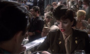 Movie still from “New York, New York” (1977), directed by Martin Scorsese – A woman in a military uniform talking to a man; Medium shot, Over the shoulder angle