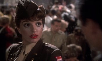 Movie still from “New York, New York” (1977), directed by Martin Scorsese – A woman dressed in a military uniform and a hat; Close Up shot, Over the shoulder angle