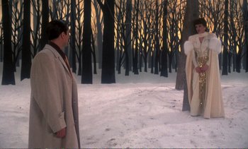 Movie still from “New York, New York” (1977), directed by Martin Scorsese – Two people in a forest with trees and snow; Wide shot, Over the shoulder angle