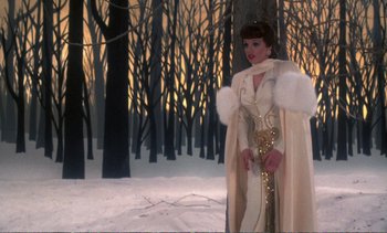 Movie still from “New York, New York” (1977), directed by Martin Scorsese – A woman dressed in white standing in the snow; Medium shot, Low angle