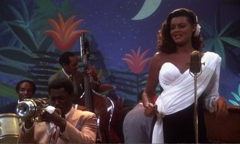 Movie still from “New York, New York” (1977), directed by Martin Scorsese – A group of people that are sitting in front of a wall; Medium shot, Low angle