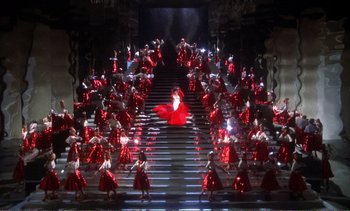 Movie still from “New York, New York” (1977), directed by Martin Scorsese – A woman in a red dress is on some stairs; Extreme Wide shot, High angle