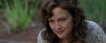 Movie still from “Gerald's Game” (2017), directed by Mike Flanagan – A person with long hair and green eyes; Close Up shot, Over the shoulder angle