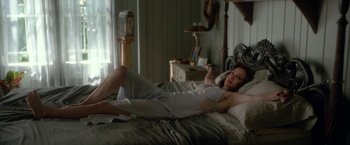 Movie still from “Gerald's Game” (2017), directed by Mike Flanagan – A woman laying on a bed in a room; Medium shot, High angle