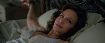 Movie still from “Gerald's Game” (2017), directed by Mike Flanagan – A woman laying on a bed looking at the camera; Close Up shot, High angle
