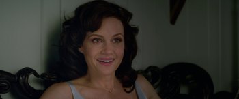 Movie still from “Gerald's Game” (2017), directed by Mike Flanagan – A person smiling for the camera; Close Up shot, Over the shoulder angle
