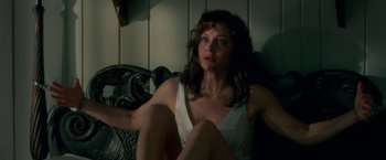 Movie still from “Gerald's Game” (2017), directed by Mike Flanagan – A woman sitting on a couch in a room; Medium shot, High angle