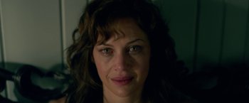 Movie still from “Gerald's Game” (2017), directed by Mike Flanagan – A woman's face in a dark room; Close Up shot, Over the shoulder angle