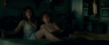 Movie still from “Gerald's Game” (2017), directed by Mike Flanagan – A man sitting on a bed next to a woman; Medium shot, High angle
