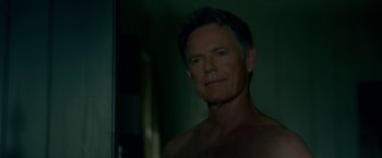 Movie still from “Gerald's Game” (2017), directed by Mike Flanagan – A shirtless man looking into a bathroom mirror; Close Up shot, Low angle