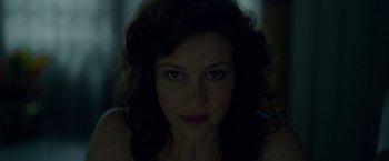 Movie still from “Gerald's Game” (2017), directed by Mike Flanagan – A woman's face in the dark; Close Up shot, Low angle