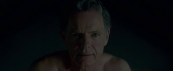Movie still from “Gerald's Game” (2017), directed by Mike Flanagan – A person's face in the dark; Close Up shot, Low angle