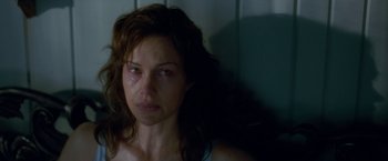 Movie still from “Gerald's Game” (2017), directed by Mike Flanagan – A person with a crying look on her face; Close Up shot, Over the shoulder angle