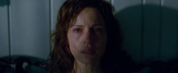 Movie still from “Gerald's Game” (2017), directed by Mike Flanagan – A person with a sad look on their face; Close Up shot, Over the shoulder angle