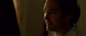 Movie still from “Gerald's Game” (2017), directed by Mike Flanagan – A man's face in the dark; Close Up shot, Over the shoulder angle