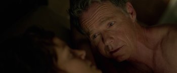 Movie still from “Gerald's Game” (2017), directed by Mike Flanagan – An older man looking at the camera with his eyes wide open; Close Up shot, Over the shoulder angle