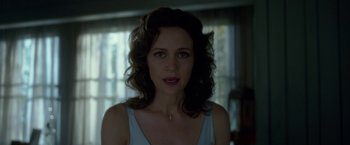 Movie still from “Gerald's Game” (2017), directed by Mike Flanagan – A person with curly hair; Close Up shot, Over the shoulder angle